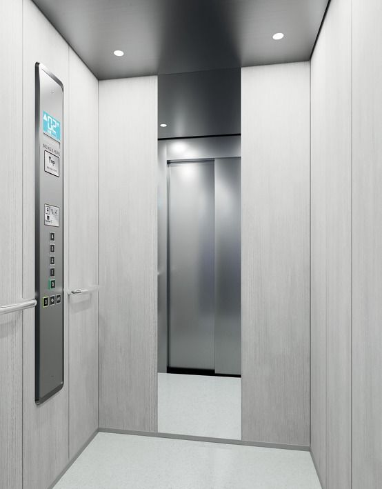 Cabina minimalista moderna blanca con panel digital — Ascensores Skylift